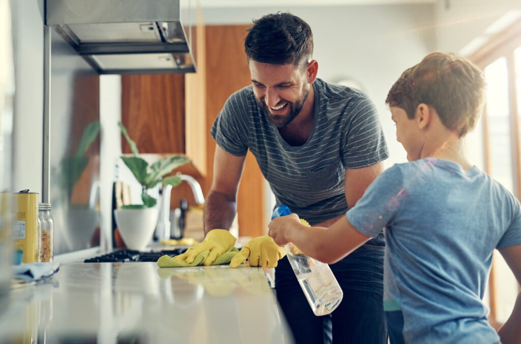 father and son cleaning together in a house in Toronto